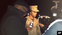 Marine Base Quantico spokesman Lt. Agustin Solivan briefs reporters following a shooting incident on the base, March 22, 2013.