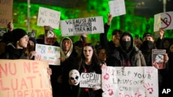 Protesters rally against Calin Georgescu, the independent candidate for Romanian presidency who won the first round of elections making it to the December 8 runoff, in Bucharest, Romania, Nov. 27, 2024.