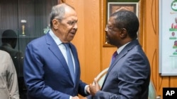 Speaker of the National Assembly of Kenya Moses Wetangula, right, and Russian Foreign Minister Sergey Lavrov shake hands prior to their talks in Nairobi, Kenya, on Monday, May 29, 2023