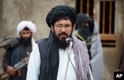 FILE - Mullah Mohammed Rasool, the newly-elected leader of a breakaway faction of the Taliban, speaks during a gathering in Farah province, Afghanistan.