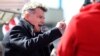 French Communist Party MP, Fabien Roussel, speaks in front of the 'Fonderie de Bretagne foundry, a subsidiary of the Renault group, during a gathering of striking employees on March 23, 2021 in Caudan, western France.