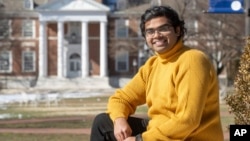 Pranay Karkale, a first-year graduate student at Johns Hopkins University from Nashik, India, stands at the university's campus in Baltimore on Sunday, Feb. 18, 2024. (AP Photo/Steve Ruark)