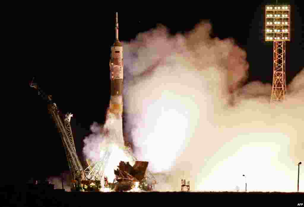 April 5: The Soyuz-FG rocket booster with Soyuz TMA-21 space ship carrying a new crew to the International Space Station, ISS, blasts off from the Russian leased Baikonur cosmodrome, Kazakhstan. (AP)