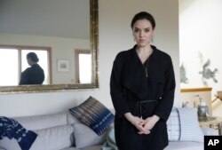 In this photo taken Tuesday, Feb. 21, 2017, Erin Schrode poses at her home in Mill Valley, California.