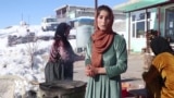 ڕۆژێک لە گوند لە نێو بەفر و زستاندا