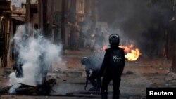 FILE - Security forces clash with supporters of Senegal opposition leader Ousmane Sonko after Sonko was sentenced to prison, in Dakar, Senegal, June 3, 2023. 