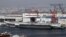 A general view shows navy soldiers standing on China's first aircraft carrier 'Liaoning' as it is berthed in a port in Dalian, northeast China's Liaoning province, September 25, 2012. 