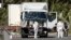 FILE - Investigators work near the heavy truck that ran into a crowd at high speed in Nice, France, July 15, 2016. A Maryland man allegedly inspired by that attack has been detained, the U.S. Justice Department said Monday. 
