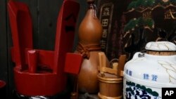 Traditional containers to keep Japanese sake are placed for decorations at a room shown during a media tour at the Ozawa Sake Brewery in Ome, on the western outskirts of Tokyo, Nov. 13, 2024.