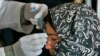 An Afghan woman affected by leishmaniasis gets an injection at a free specialized clinic for supported by World Health Organization in Islam Qala, Herat, Afghanistan, Oct. 30, 2010.