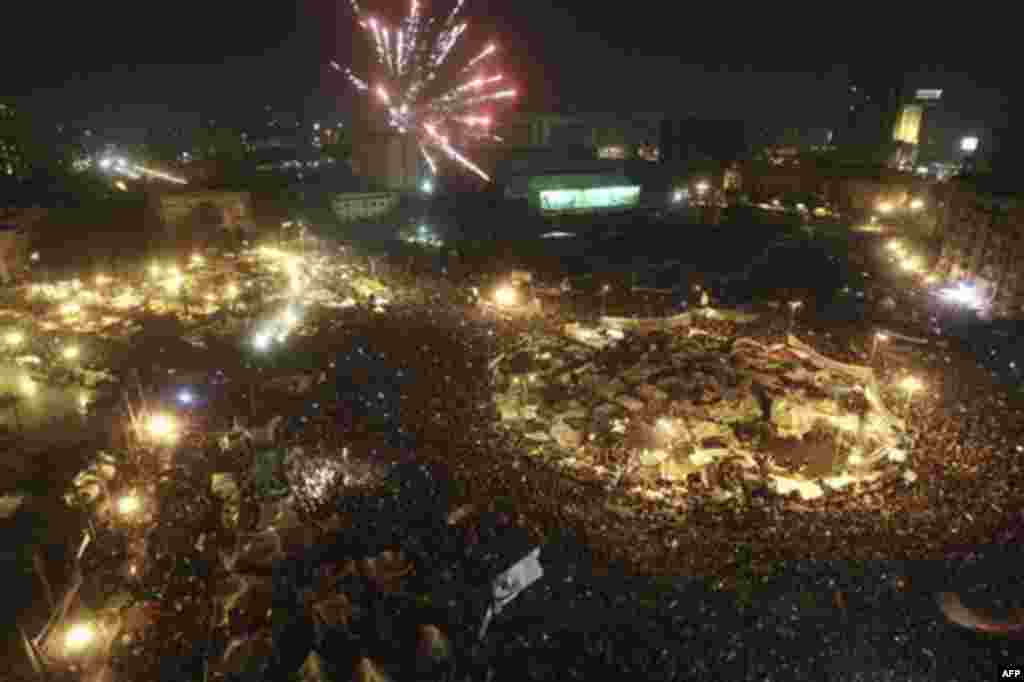 Fire works seen over Tahrir Square as Egyptians celebrate after President Hosni Mubarak resigned and handed power to the military in Cairo, Egypt, Friday, Feb. 11, 2011. Egypt exploded with joy, tears, and relief after pro-democracy protesters brought dow