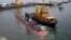 The INS Kalvari, one of the six Scorpene diesel-electric attack submarines, is set afloat at the naval dockyard in Mumbai, India, Thursday, Oct. 29, 2015. 