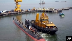The INS Kalvari, one of the six Scorpene diesel-electric attack submarines, is set afloat at the naval dockyard in Mumbai, India, Thursday, Oct. 29, 2015. 