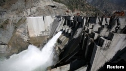 FILE - A general view of a newly inaugurated 450-megawatt hydropower project at Baglihar Dam on the Chenab River, which flows from Indian Kashmir into Pakistan, is seen at Chanderkote, about 145 km (90 miles) north of Jammu, October 10, 2008.