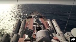 The Russian missile cruiser Moskva sails near the Syrian coast in this photo made from video posted to the Russian Defense Ministry official web site on Friday, Nov. 27.