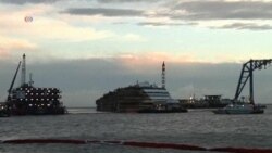 Workers Raise Italian Cruise Ship From Reef