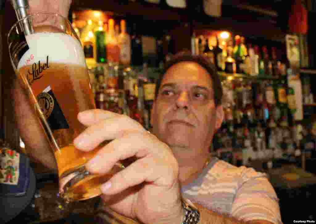 Owner Fernando Coimbra is a South African of Portuguese descent who is proud to pour a pint in the 127-year-old venue that now serves women. Photo by Darren Taylor