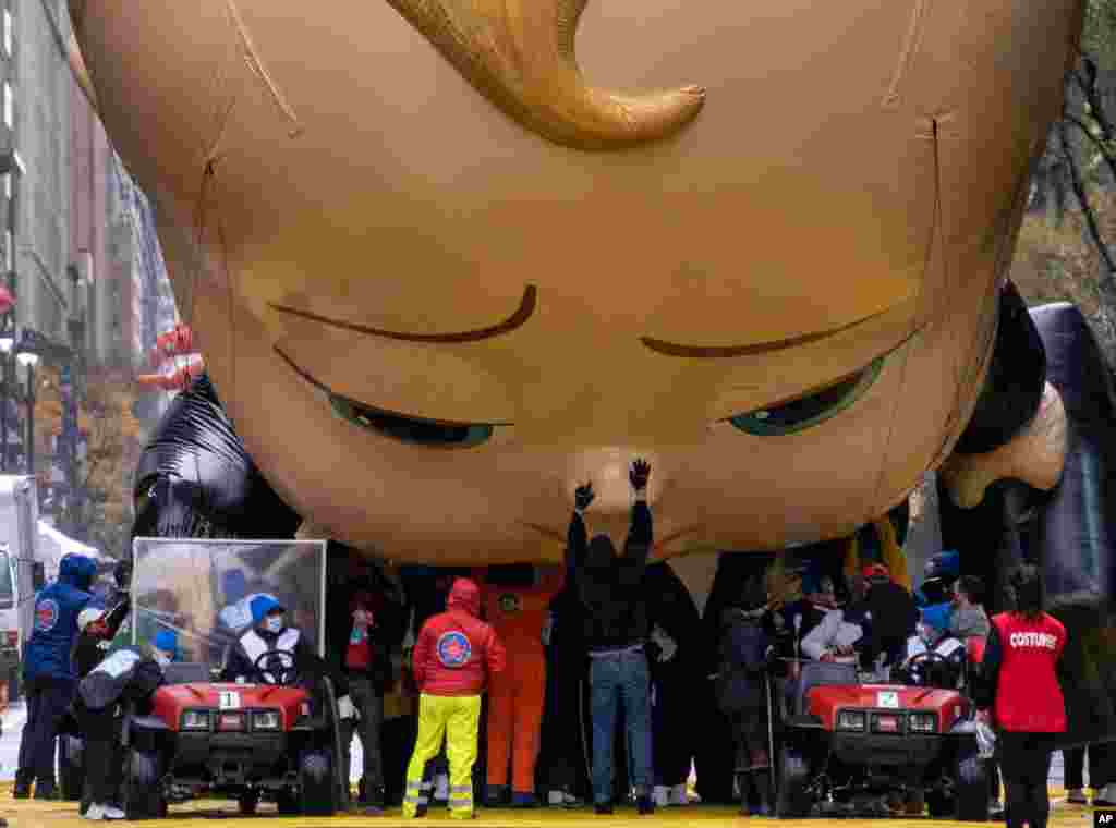 The Boss Baby balloon is deflated as it ends its appearance during the modified Macy's Thanksgiving Day Parade in New York.
