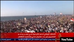 FILE - A screenshot of Al Jazeera showing anti-government protests in the Egyptian port city of Alexandria on Aug. 30, 2013.