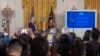 FILE - President Joe Biden listens to actress Jessica Alba speak during a reception at the White House in celebration of the Hispanic Heritage Month to honor the contributions of the Latino community to the United States, Sept. 18, 2024.