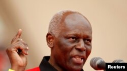 FILE:: Angola's now-former president and leader of the ruling MPLA party Jose Eduardo dos Santos addresses supporters during the party's last rally for the parliamentary elections in Camama. Taken 8.29.2012