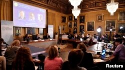 Goran K Hansson, Secretary General of the Royal Swedish Academy of Sciences, and academy members Sara Snogerup Linse and Olof Ramstrom, announce the winners of the 2019 Nobel Prize in Chemistry during a news conference at the Royal Swedish Academy…