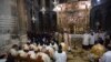 Catholics Christians pray in Church of the Holy Sepulchre, traditionally believed by many to be the site of the crucifixion of Jesus Christ, during Easter Sunday procession in Jerusalem's old city, April 21, 2019.