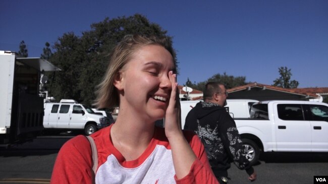 Caila Sanford survived the mass shooting during a Las Vegas concert last year. She never expected there would be a mass shooting so close to her home in California. She's now afraid of going to places with a lot of people. (E. Lee/VOA)