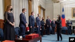 In this photo released by the Taiwan Presidential Office, Taiwanese President Tsai Ing-wen, second right, greets lawmakers from Baltic states at the Presidential Office in Taipei, Nov. 29, 2021.