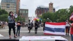 A member of the Thai Rights Now movement speaks to the demonstrators during the 7th anniversary of Thailand's coup rally at Washington Square Park, New York. May 22, 2021