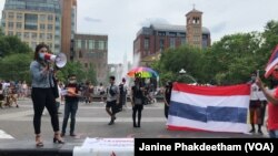 A member of the Thai Rights Now movement speaks to the demonstrators during the 7th anniversary of Thailand's coup rally at Washington Square Park, New York. May 22, 2021