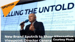 Dmitry Kiselev is seen at the announcement of the creation of the new media brand, Sputnik, in this screengrab from the Sputnik website.
