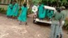 Women being taken to the magistrates' courts in Zimbabwe following street protests over the high cost of living in Zimbabwe two weeks ago.