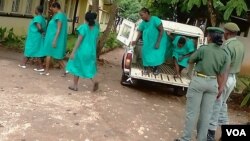 Women being taken to the magistrates' courts in Zimbabwe following street protests over the high cost of living in Zimbabwe two weeks ago.