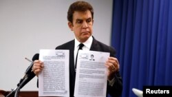 Honduran opposition candidate Salvador Nasralla displays documents filed with Honduran election officials during a news conference in Washington, U.S., Dec. 19, 2017.
