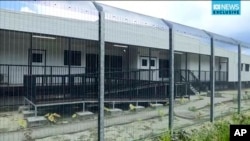 In this file photo made from Australia Broadcasting Corporation video taken shows housing of asylum seekers protesting the possible closure of their detention center, on Manus Island, Papua New Guinea, Oct. 31, 2017.