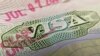This photo illustration shows a visa stamp on a foreign passport in Los Angeles on June 6, 2020. - The United States said July 6 it would not allow foreign students to remain in the country if all of their classes are moved online in the fall over the…