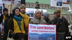 FILE - Supporters demonstrate for the release of Saeed Malekpour, in Montreal, Quebec, Canada, Jan. 22, 2012. Malekpour, 35, a Canadian-Iranian software engineer, was facing imminent execution in Tehran for allegedly operating a pornography website.