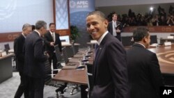 U.S. President Barack Obama looks over his shoulder was he arrives for the Asia-Pacific Economic Cooperation Summit leaders plenary session in Kapolei, Hawaii on Sunday, Nov. 13, 2011.