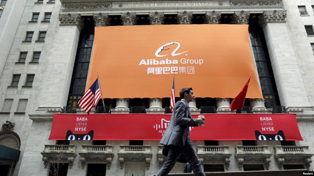 FILE - Signage for Alibaba Group Holding Ltd. covers the front facade of the New York Stock Exchange, in Manhattan.