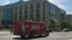 FILE - A Coca-Cola delivery truck drives past an office building in Washington, DC. (Photo: D. Bekheet)