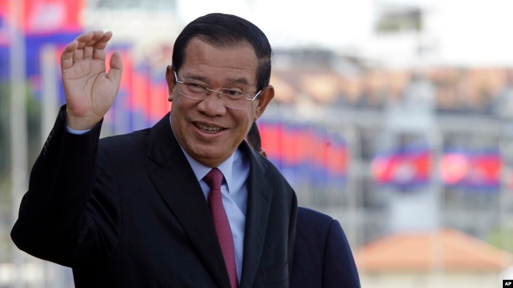 Cambodia's Prime Minister Hun Sen greets his government officials as he arrives to watch the boat races at the Royal Palace during the annual water festival in Phnom Penh, Cambodia, Thursday, Nov. 2, 2017. The 3-day traditional water festival is dedicated