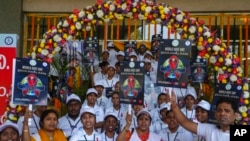 FILE - Indian health workers, volunteers and students take out a health awareness procession to mark the World AIDS Day in Hyderabad, India, Dec. 1, 2022.