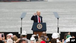 FILE - President Donald Trump gestures to the crowd after speaking at a rally at Rivertowne Marina, June 7, 2017, in Cincinnati, Ohio.