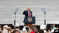 President Donald Trump gestures to the crowd after speaking during a rally at Rivertowne Marina, June 7, 2017, in Cincinnati, Ohio.
