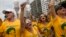 FILE - Demonstrators wear T-shirts with the face of Judge Sergio Moro, who is heading the Petrobras investigation, as they protest against government corruption on Copacabana beach in Rio de Janeiro, Brazil, March 13, 2016. 