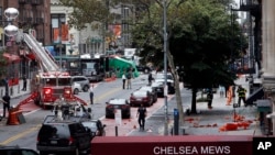 Emergency personnel work at the scene of Saturday's explosion on West 23rd Street in Manhattan's Chelsea neighborhood in New York, Sept. 19, 2016. 