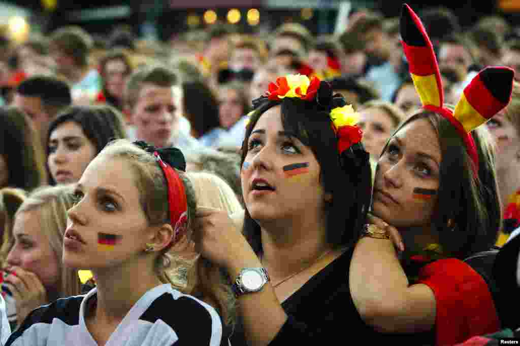 German fans watch as their team play against the U.S. at the Fanmeile public viewing arena in Berlin, June 26, 2014.