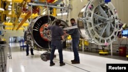 FILE - Technicians build LEAP engines for jetliners at a new, highly automated General Electric (GE) factory in Lafayette, Indiana, March 29, 2017. 