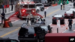 Emergency personnel work at the scene of Saturday's explosion on West 23rd Street in Manhattan's Chelsea neighborhood in New York, Sept. 19, 2016. 